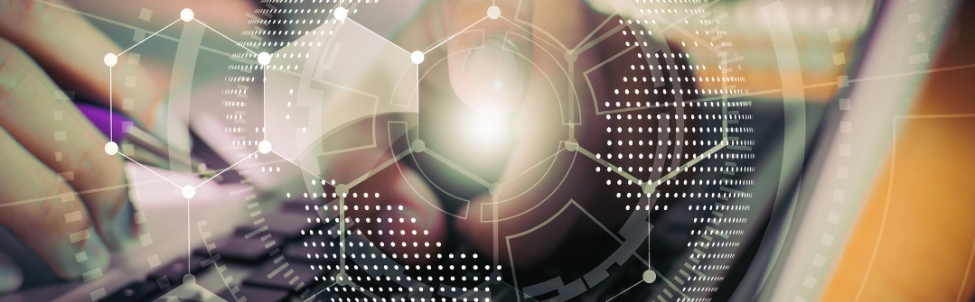 hand typing on laptop with pen with technology overlay